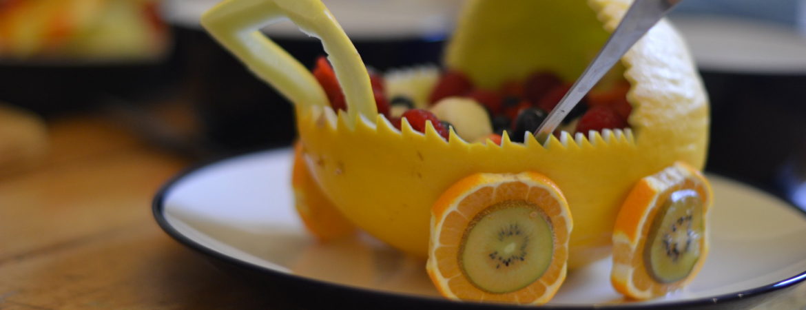 baby carriage made of fruit