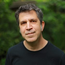 author scott nadelson standing by a forest
